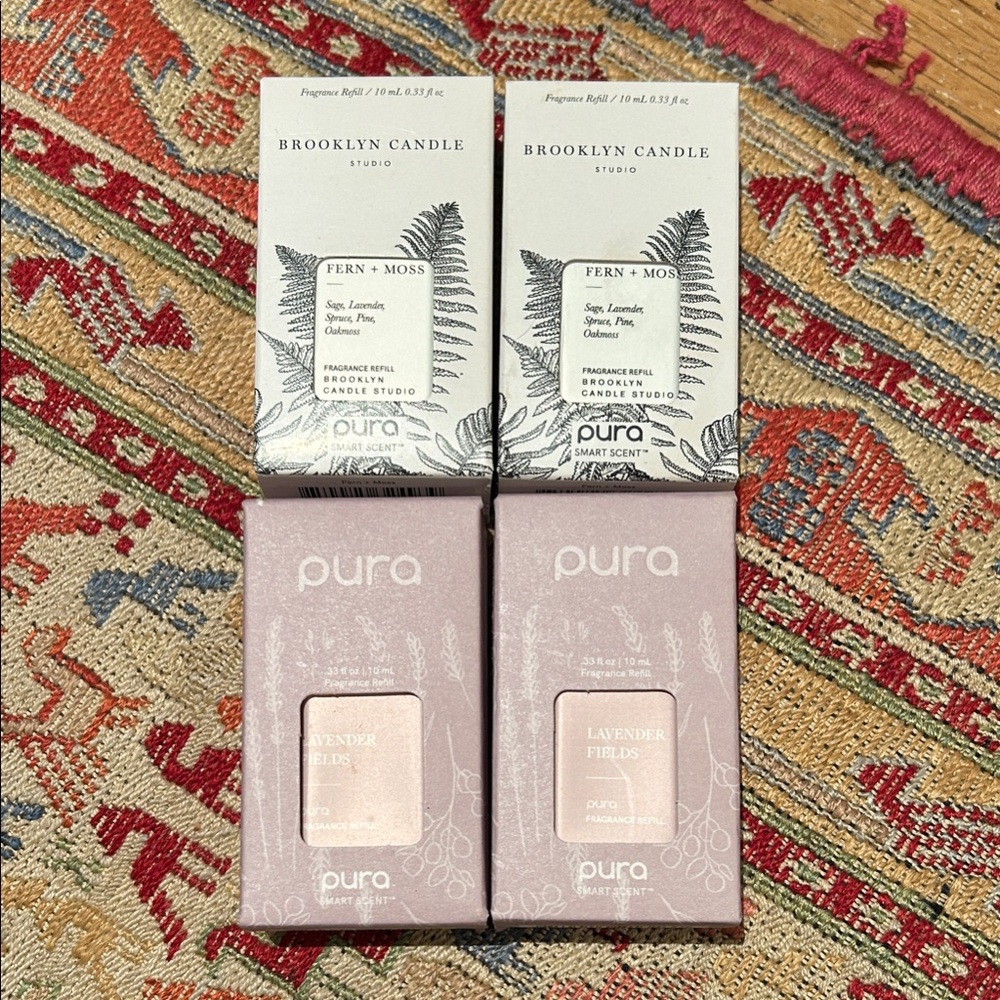 Four Pura home scents. Holiday! 2 Lavender and 2 Fern + Moss